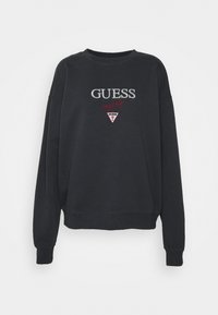 Sudadera negra con cuello acanalado, mangas largas y un corte relajado. Presenta el logo bordado en blanco y rojo "GUESS" en el frente.