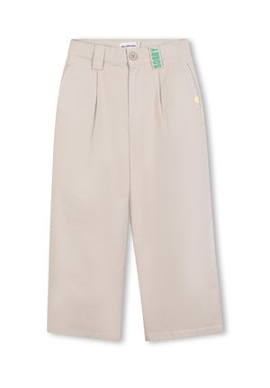 Beige wijd uitgesneden broeken met plooien, gemaakt van zachte stof. Voorzien van een groene 'SORRY' label, een knoopsluiting en riemlussen.
