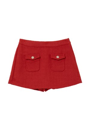 Mini gonna in tweed rosso con taglio dritto, due tasche frontali e dettagli con bottoni in metallo. Il tessuto testurizzato aggiunge profondità.