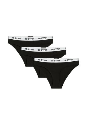 Trois slips noirs de style brief avec des bandes élastiques blanches à la taille affichant des logos "G-STAR" répétés en texte noir.