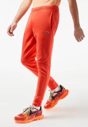 LIFESTYLE - Pantalones deportivos - orange