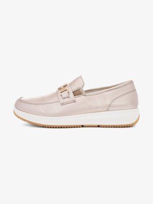 Beige leather slip-on loafer with a gold buckle detail, white platform sole, and a textured rubber outsole for grip.