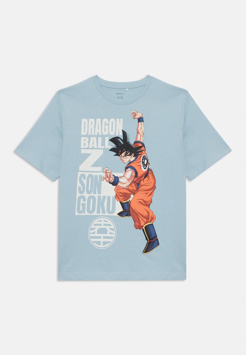 T-shirt en coton bleu clair avec une illustration d'un personnage en tenue d'arts martiaux orange, cheveux noirs, texte "Dragon Ball Z" et logo.