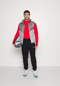 Nike Performance NIKE ACADEMY23 TRACK PANTS - Pantalones deportivos - black/white
