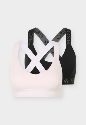 Deux soutiens-gorge de sport à bretelles croisées, l'un en rose clair avec des bretelles blanches, l'autre en noir avec des bretelles gris foncé et des logos sur les bandes.