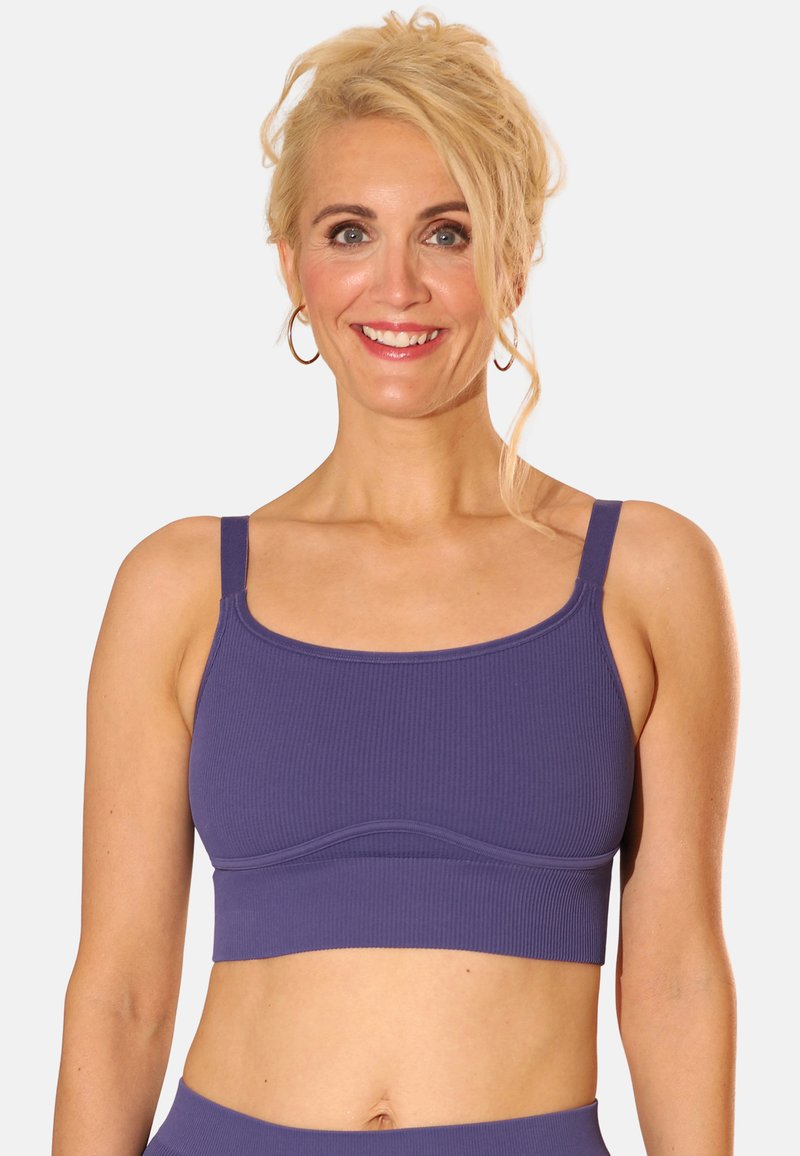 Purple ribbed bralette with wide straps and a rounded neckline. Features a smooth underband and a fitted design for comfort.