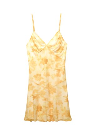 Keltainen kukkakuosislip dress, jossa on ohuet hihnat, pehmeä kangas ja virtaava muoto. Sisältää rypytetyn yläosan ja kevyen, läpikuultavan rakenteen.