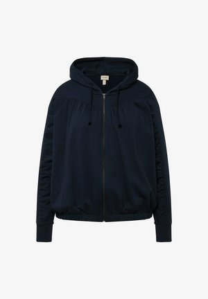 Laivastonsininen huppari, jossa on etuvetoketju, kerrostetut sivuyksityiskohdat ja ribbatut hihansuut. Pehmeää kangasta ja rento malli.