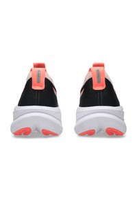 Black athletic shoes with pink accents, featuring a textured upper, white midsole, and rubber outsole with pink grip patterns.