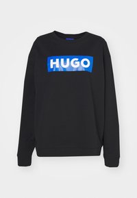 Black sweatshirt made of cotton blend, featuring a blue rectangular graphic with white text "HUGO" across the chest. Round neckline and ribbed cuffs.