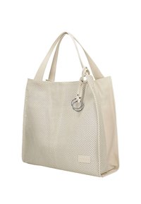 Beżowa torebka tote z perforowanej skóry z dwoma paskami na ramię, minimalistyczny design, błyszczące srebrne akcesoria i boczny akcent w postaci pierścionka.