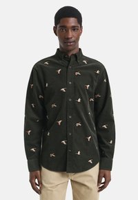 Donkergroen corduroy shirt met kleurrijke vogelborduursels, met knoopsluiting, lange mouwen en een afgeronde zoom.