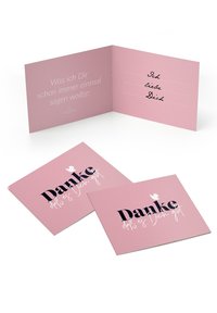 Rosa gratulationskort med svart och vitt text. Inuti finns det rader för att skriva meddelanden. Utsidan har "Danke" och en liten duva-illustration.