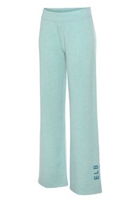 Lichtblauwe, wijde sweatpants gemaakt van zachte stof met een gladde textuur; heeft een omgevouwen tailleband en een logo dat op de zijkant is gedrukt.