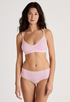 Lichtroze bralette met dunne verstelbare bandjes, met een glad, naadloos ontwerp. Bijpassende lichtroze hipsteronderbroek met een rekbare tailleband.
