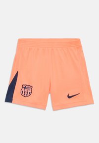 Futbalové šortky Nike v jasnej oranžovej farbe s námorníckym akcentom. Na ľavom stehne sa nachádza emblém klubu a na pravom je logo. Elastický pás.
