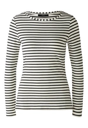 Lange mouwen, ronde hals top in het wit met gedurfde zwarte horizontale strepen. Heeft een getailleerd ontwerp en een zachte katoenstof.