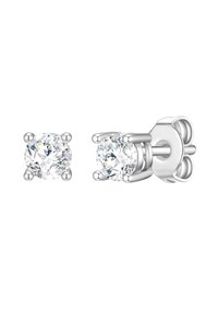 Pendientes de plata con tachuelas que presentan cristales redondos y claros, diseñados con un engaste de cuatro garras. Textura suave, acabado pulido y cierre seguro.