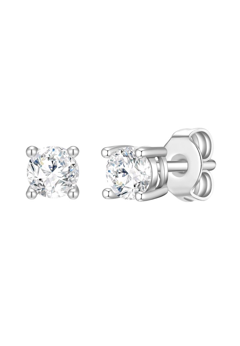 Pendientes de plata con tachuelas que presentan cristales redondos y claros, diseñados con un engaste de cuatro garras. Textura suave, acabado pulido y cierre seguro.