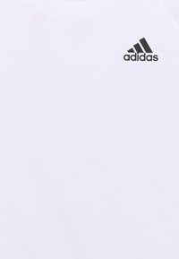adidas Performance CLUB UNISEX - T-shirt estampada - white/black