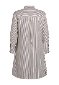 Koszula w paski z kołnierzykiem, wykonana z lekkiego materiału. Posiada długie rękawy, wentylację z tyłu oraz zakrzywiony dół w kolorze granatowym i kremowym.