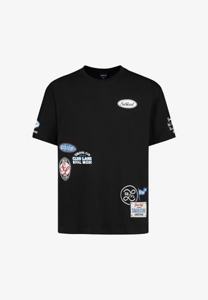 Black short-sleeve t-shirt with multiple white and blue graphic patches and text logos, including "Sublevel," "Good Stuff," and "Club Lane."