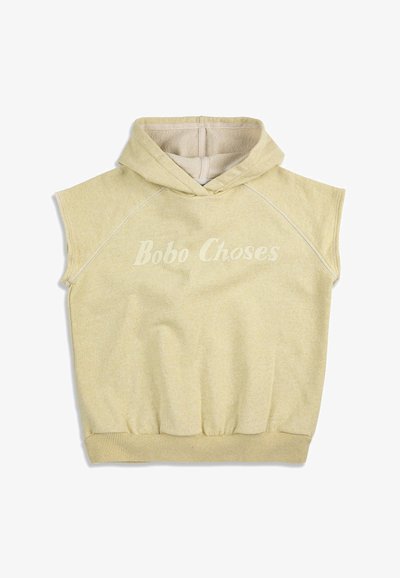 Sweat à capuche sans manches beige avec ceinture élastique et texte "Bobo Choses" imprimé sur la poitrine.