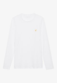 Camisa blanca de manga larga hecha de algodón, con un pequeño logotipo de un pájaro amarillo bordado en el lado izquierdo del pecho. Diseño simple y clásico.