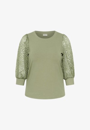 Olive green t-shirt with a round neckline, long sleeves featuring intricate lace detailing, and fitted cuffs. Smooth cotton body and textured sleeves.