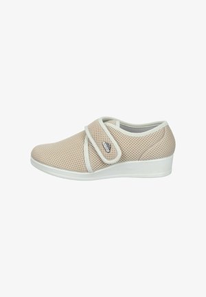 Beige mesh comfort shoe with white sole and adjustable hook-and-loop strap, designed for easy wear and breathability.