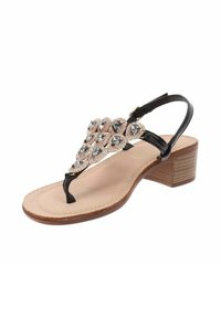 Sandalo tacco basso nero con cinturino a forma di thong. Presenta pietre decorative disposte a forma di goccia sulla parte superiore. Soletta beige.