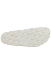 White rubber shoe sole with a textured diamond pattern and embossed logo. Features a rounded toe and smooth edges for comfort.