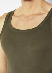 Olive green tank top made of soft, stretchy fabric. Features a classic scoop neckline and narrow shoulder straps, with a smooth texture.