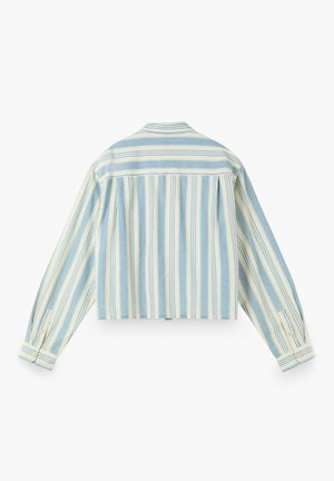 Chemise à manches longues boutonnée avec des rayures verticales et horizontales bleu clair et crème, vue de dos sur fond blanc.