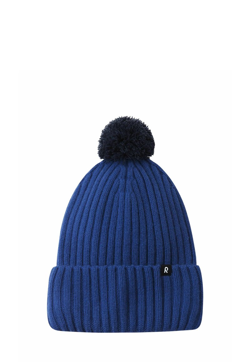 Knitted blue beanie with a ribbed texture, featuring a dark pom-pom on top and a small black logo tag on the folded brim.