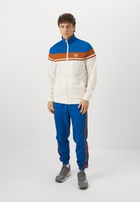 Sergio Tacchini DAMARINDO SET - Tepláková súprava - nautical blue/gardenia/mocha bisque