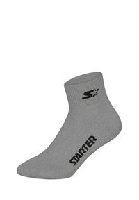 Gray ankle sock made of a textured fabric. Features a black logo and brand name "STARTER" printed on the side.