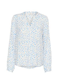 Blouse blanche à manches longues avec un col en V, présentant un motif abstrait bleu, un tissu doux et des poignets légèrement froncés pour une coupe décontractée.