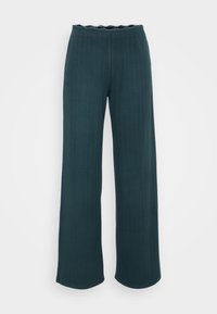 Pantalon large en bleu sarcelle, avec une texture côtelée. La taille est festonnée, ajoutant une touche délicate.