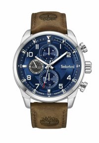 Timberland pulkstenis ar zilu ciparnīcu, nerūsējošā tērauda korpusu, hronogrāfa funkcijām, brūnu ādas siksniņu un logo, kas iepresēts siksniņā.