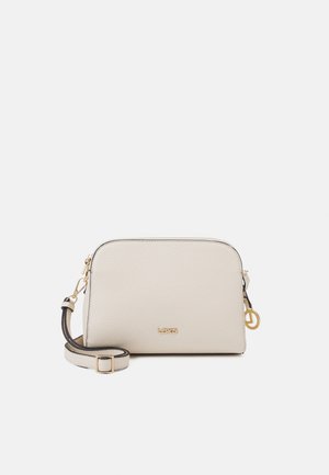 Small beige leather crossbody bag with adjustable strap, gold zipper, and small gold logo on front.