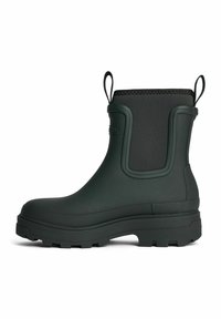 Green rubber ankle boot with a textured surface, waterproof body, pull tabs on each side, and a rugged sole for grip.