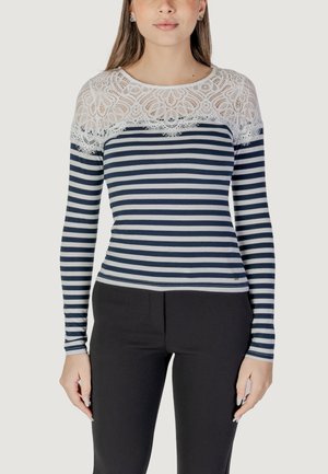Maglietta a maniche lunghe a righe con strisce orizzontali blu navy e bianche, caratterizzata da un colletto in pizzo bianco e una silhouette aderente. Tessuto dalla texture liscia.