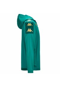 Giacca verde con cappuccio, dettagli gialli e loghi Kappa sulle spalle. Tessuto liscio con cappuccio e chiusura a zip, dotata di tasche laterali.