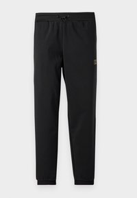 Pantalons de sport noirs avec taille à cordon, poignets élastiques et un petit logo brodé. Texture lisse et coupe cintrée pour les vêtements d'activité.