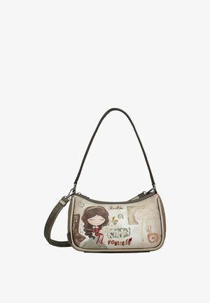 Piccola borsa a tracolla con tracolla scura, con una ragazza dei cartoni animati con gli occhi chiusi e la scritta "Conosci te stesso" su sfondo beige.