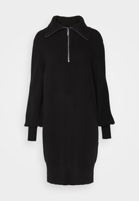 Czarna dzianinowa sukienka z wysokim kołnierzem i półzamkiem. Posiada długie, bufiaste rękawy i ściągacze na mankietach. Gładka tekstura o luźnym kroju.