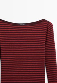 Red and dark burgundy striped long-sleeve top with a wide, shallow neckline and ribbed texture. Label reads "Massimo Dutti."