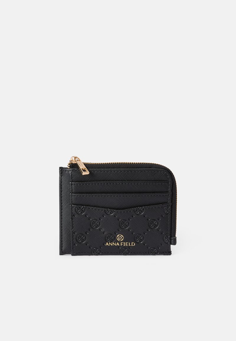 Black wallet made of textured material with a zip closure. Features gold logo, multiple card slots, and embossed pattern details.