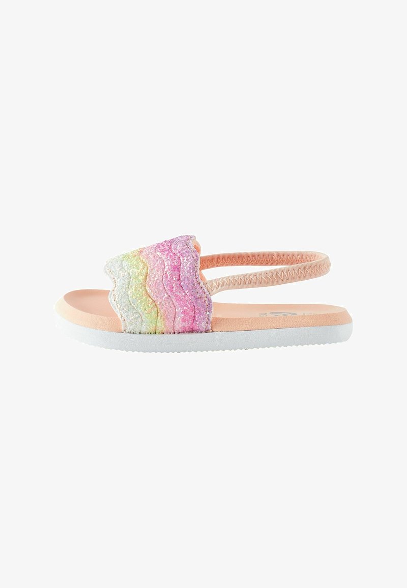 Sandale à enfiler rose et blanche avec une bride à motif ondulé multicolore scintillant. Semelle souple avec un élastique pour un maintien sûr.